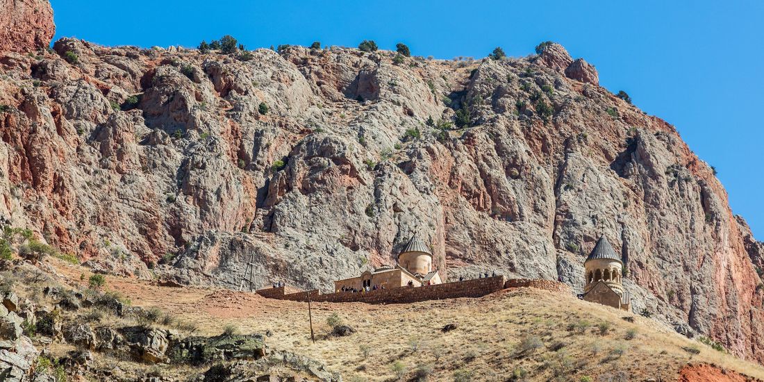 Noravank monastery beneath the red cliffs of the Amaghu canyon in Vayots Dzor, Armenia